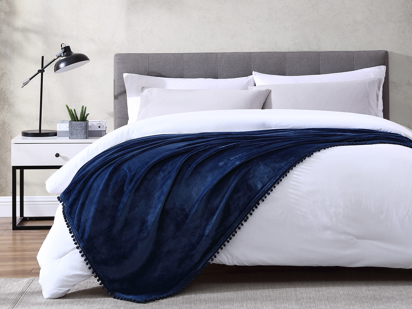 The Nesting Company Walnut Flannel Pom-Pom Throw Blanket | Navy