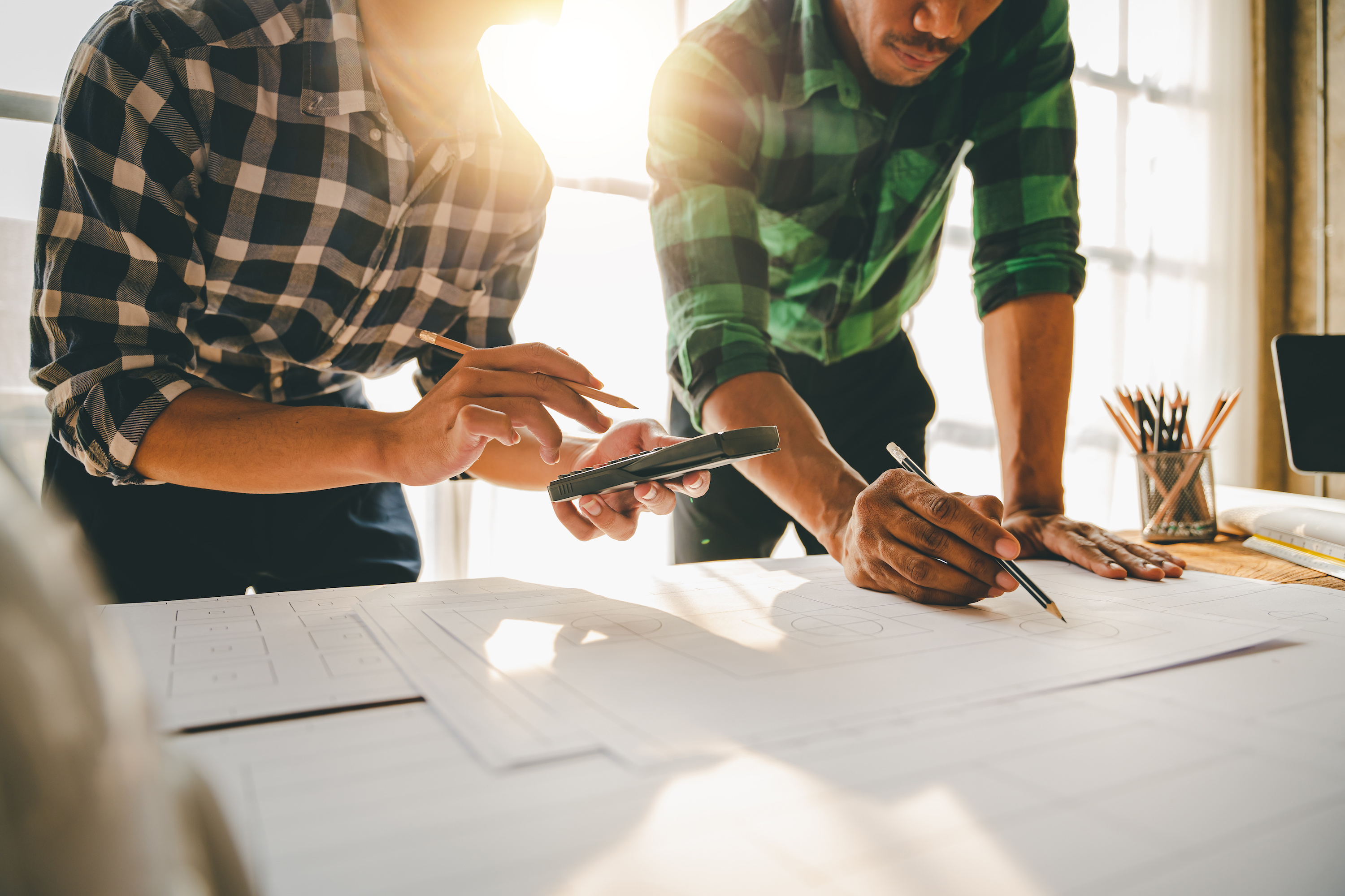Builders looking at blueprints