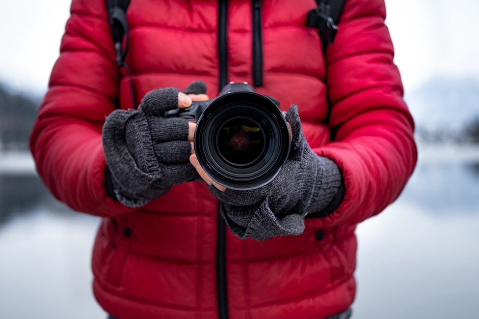 A photographer taking a photo with a used camera