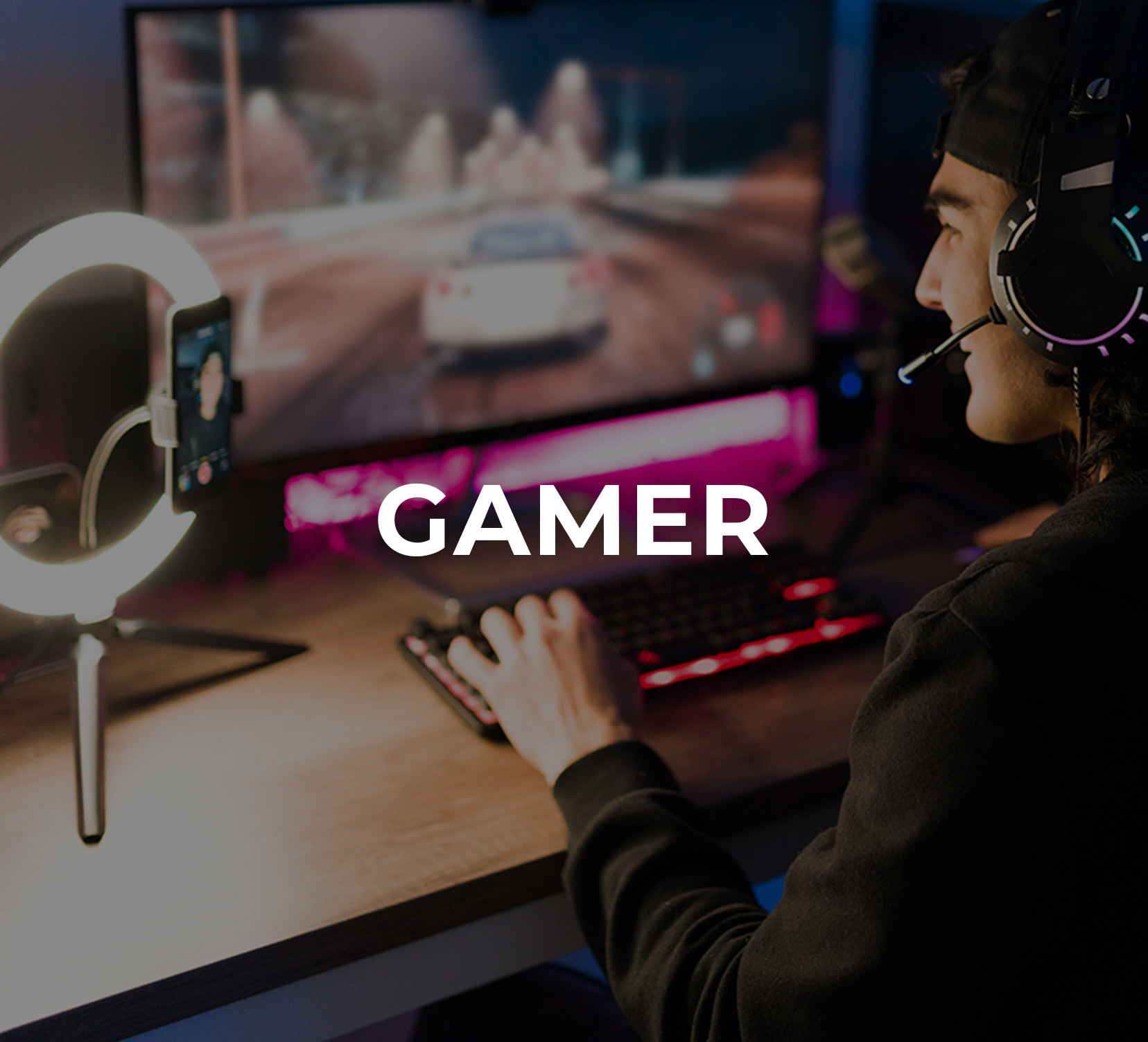 A young man wearing headphones and playing an online video game 