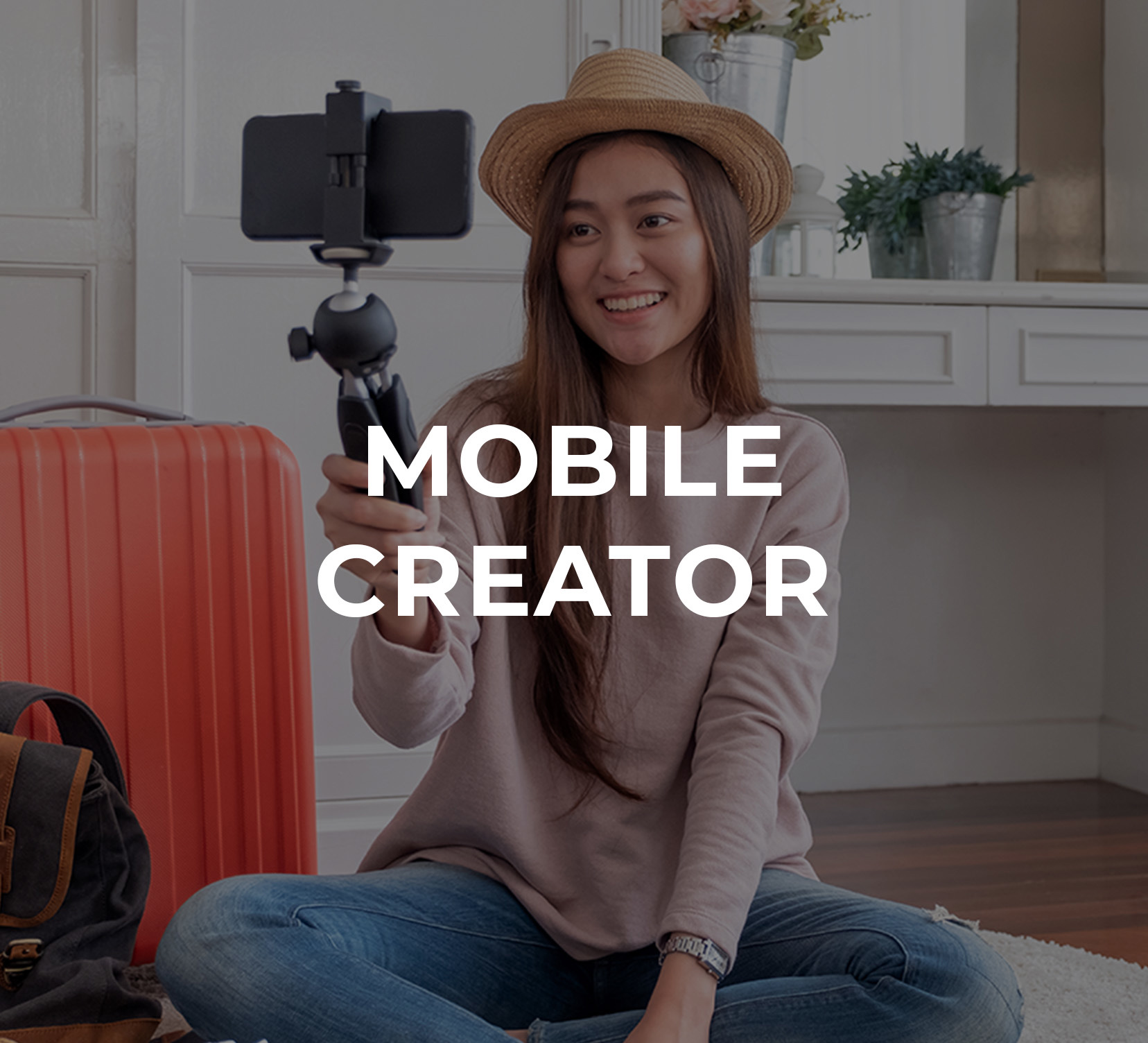 A young woman making a selfie video