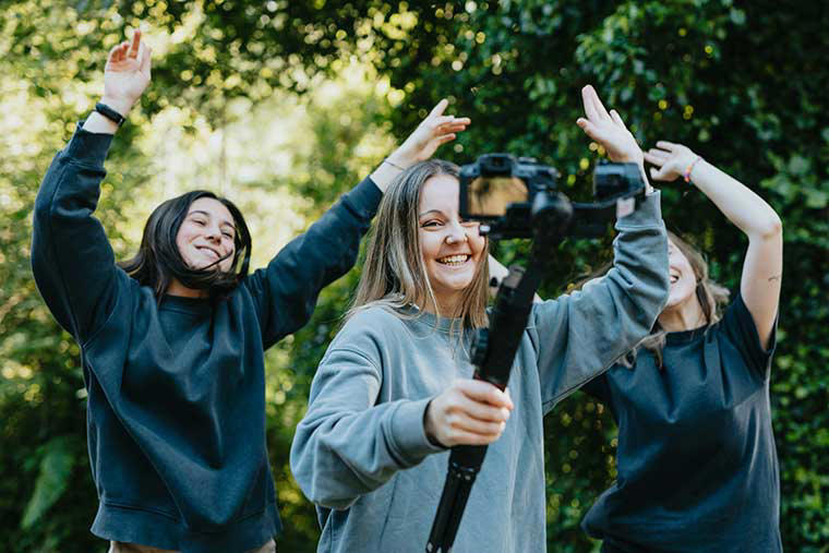 Three young women making a selfie video