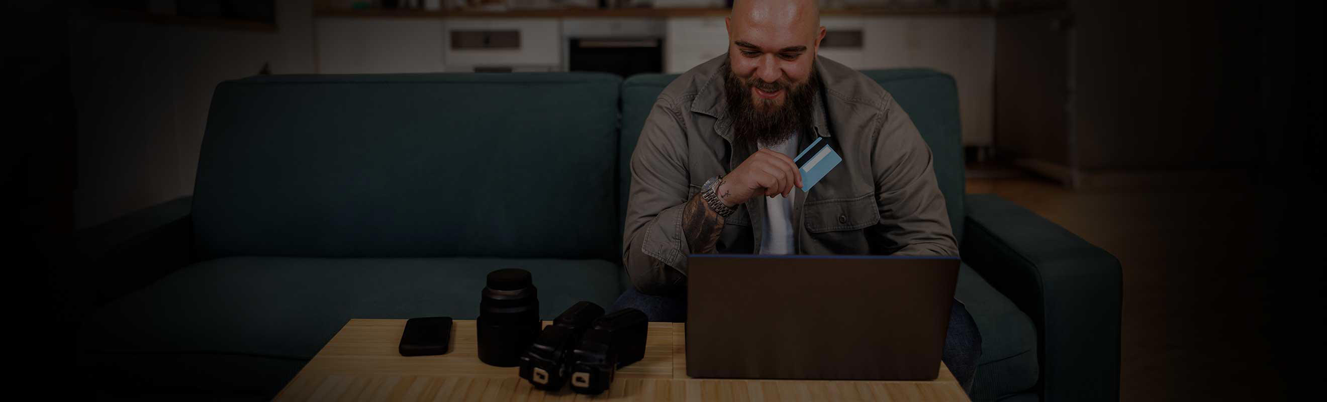 A smiling man shopping online