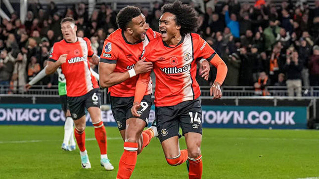 Soccer players celebrating during a game
