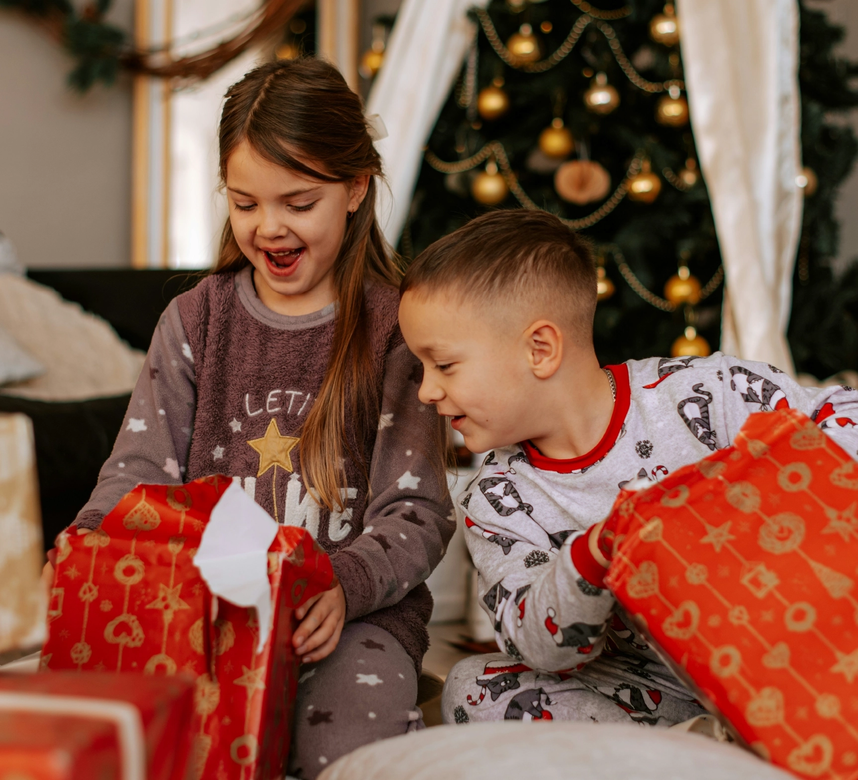 Children opening gifts on Christmas morning