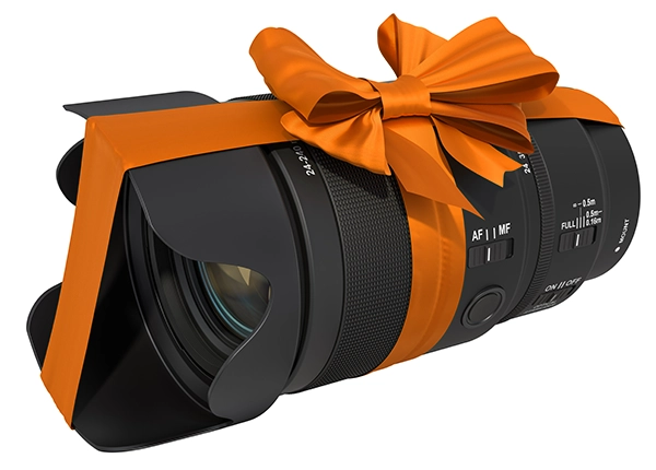camera lens wrapped with a gift ribbon and bow