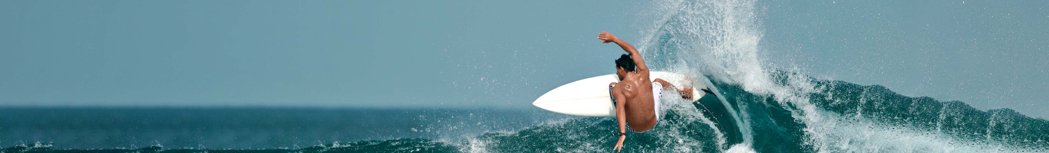 Surfer catching a wave