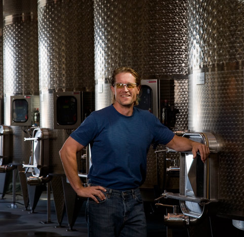 Merf standing in front of tanks