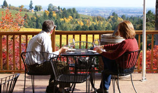 Couple outdoors tasting wine at Erath