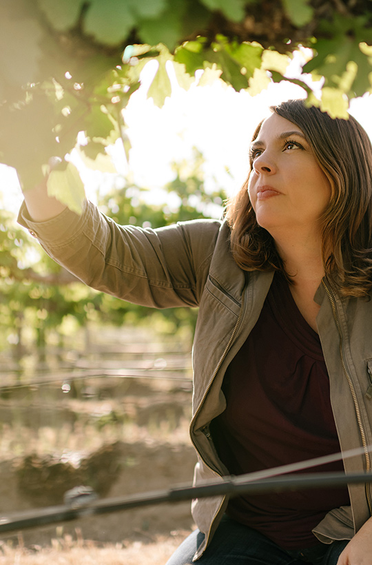 atie Nelson inspecting Grapes