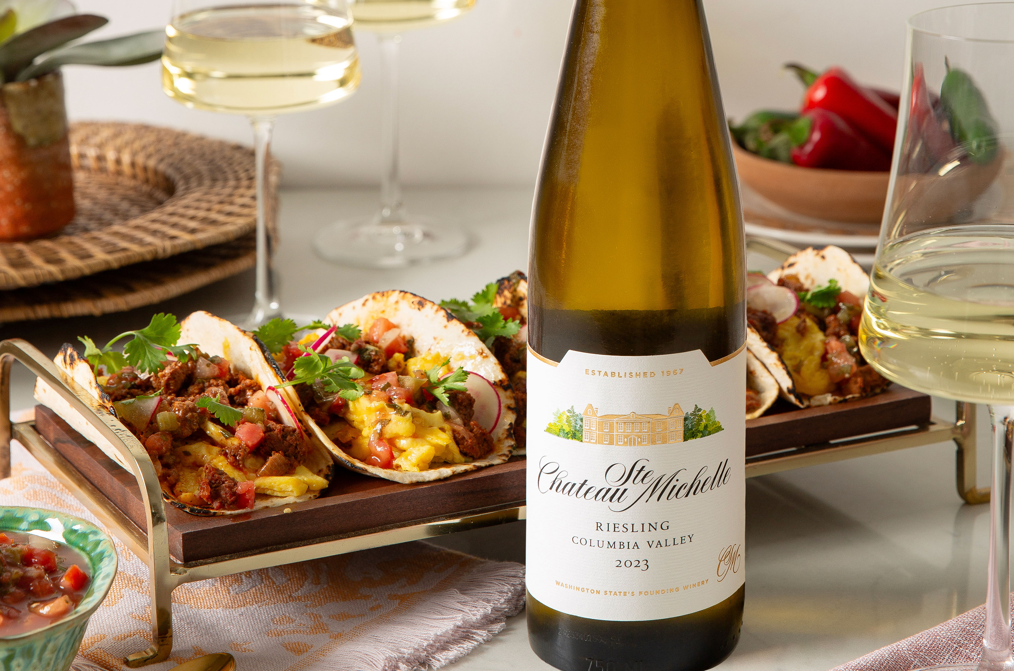 Breakfast tacos with a bottle of Chateau Ste. Michelle Columbia Valley Riesling