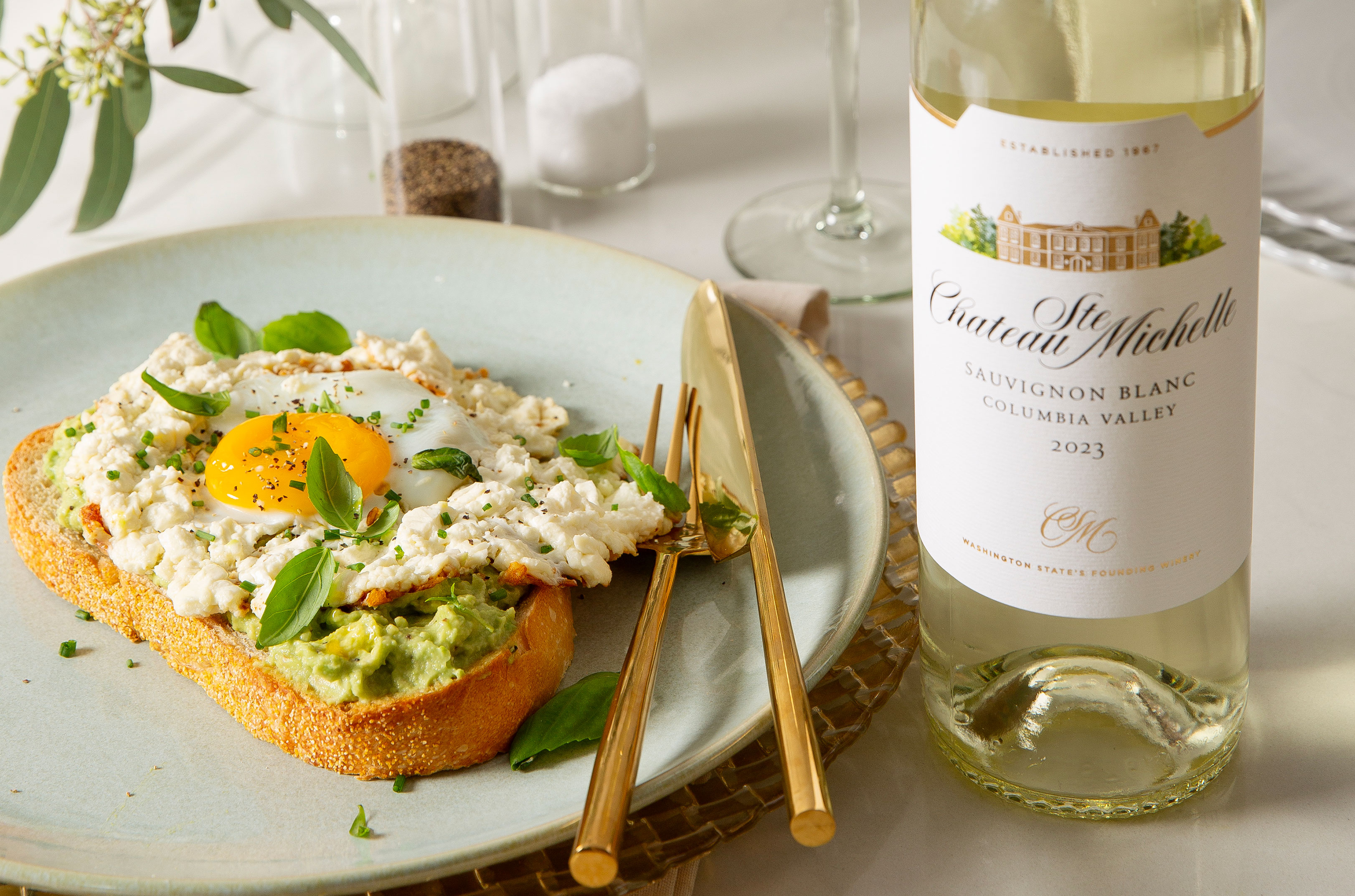 Avocado egg toast and a bottle of Chateau Ste. Michelle Sauvignon Blanc
