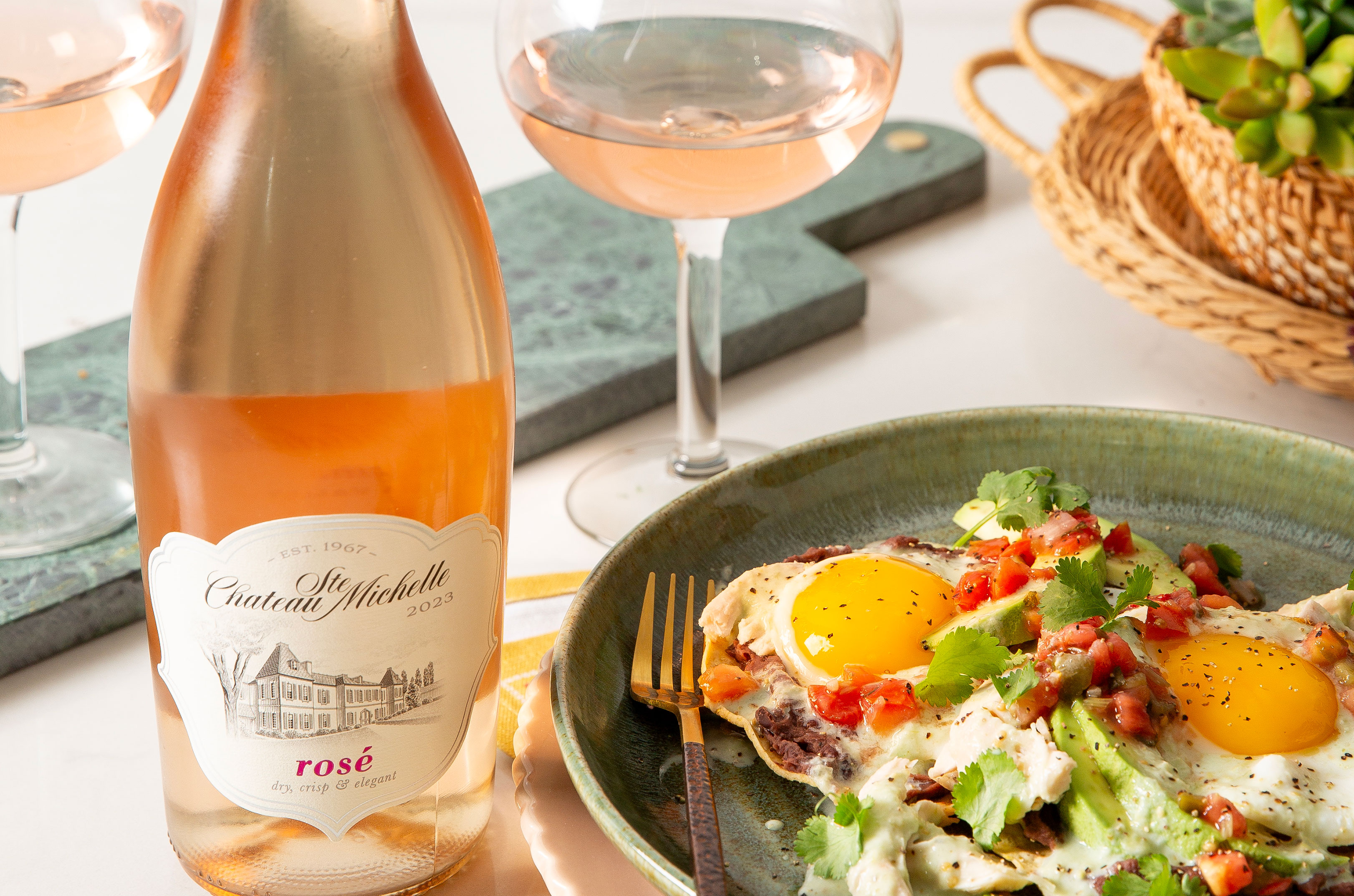 Plate of huevos rancheros and a bottle of Chateau Ste. Michelle Rosé