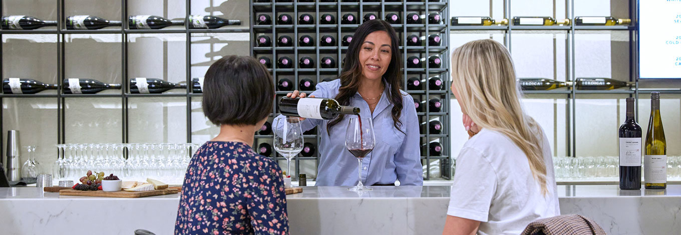 People being served at the tasting bar