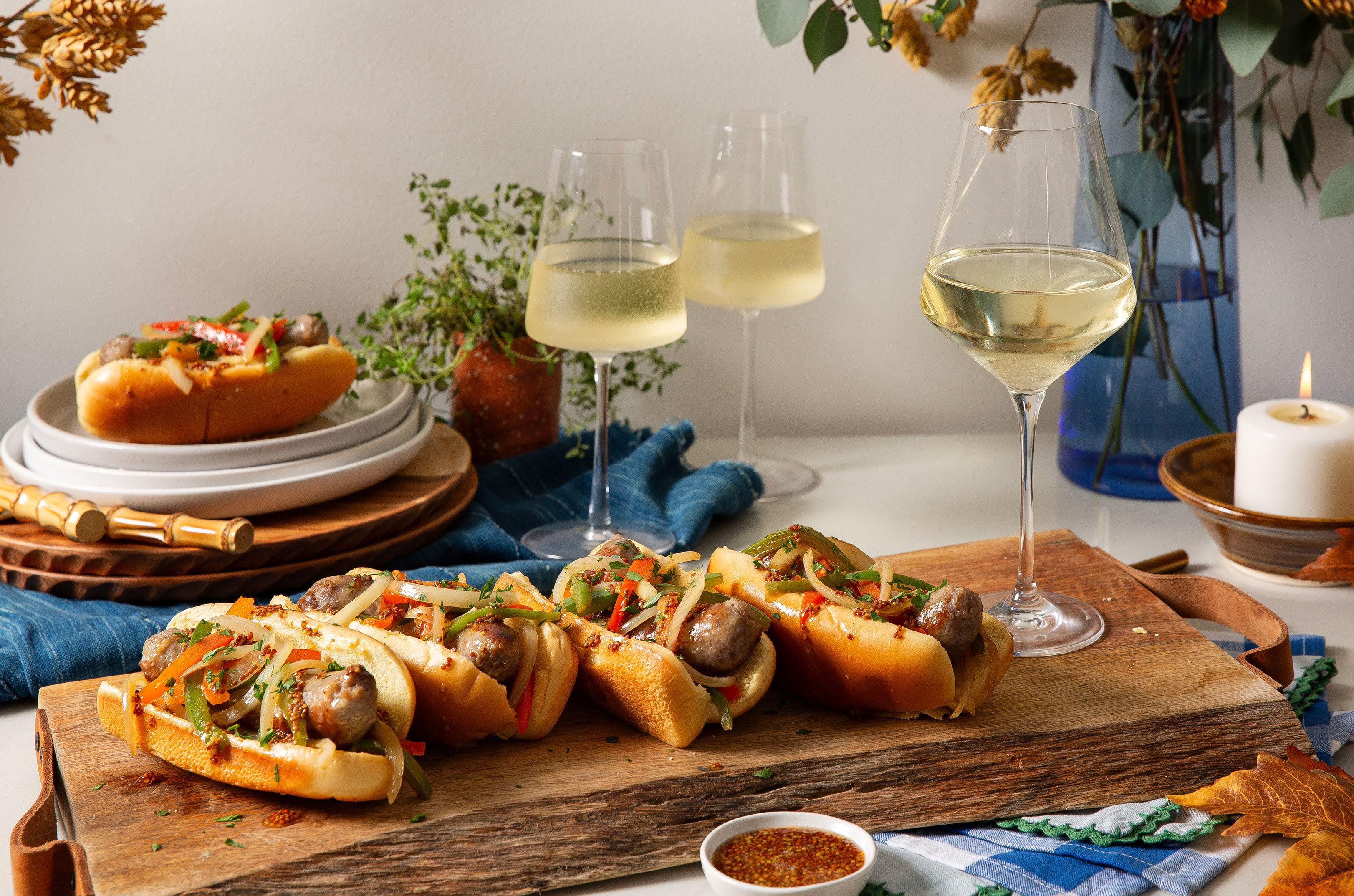 Bratwurst dogs with glasses of Riesling