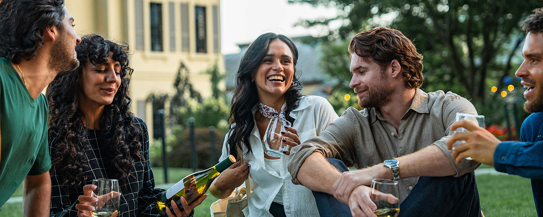 people enjoying wine outside of the Chateau