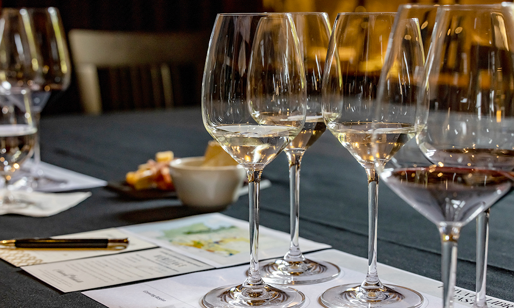 Glasses of wine on a tasting mat in an educational setting