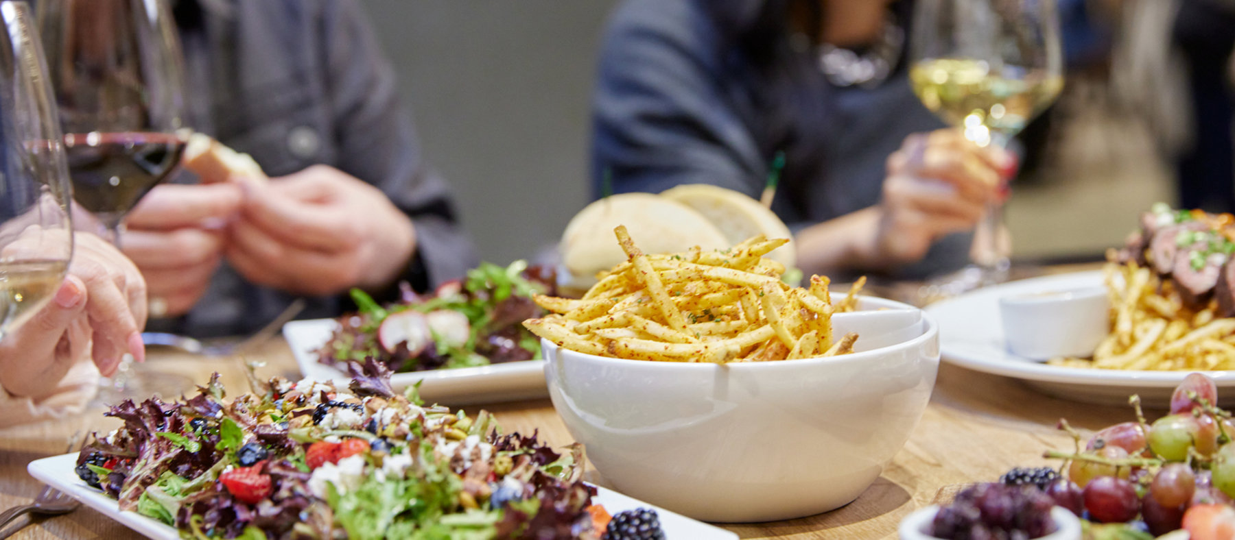 People enjoying food and wine