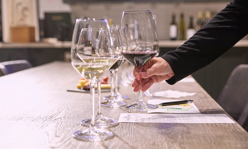 Person setting up for a wine tasting