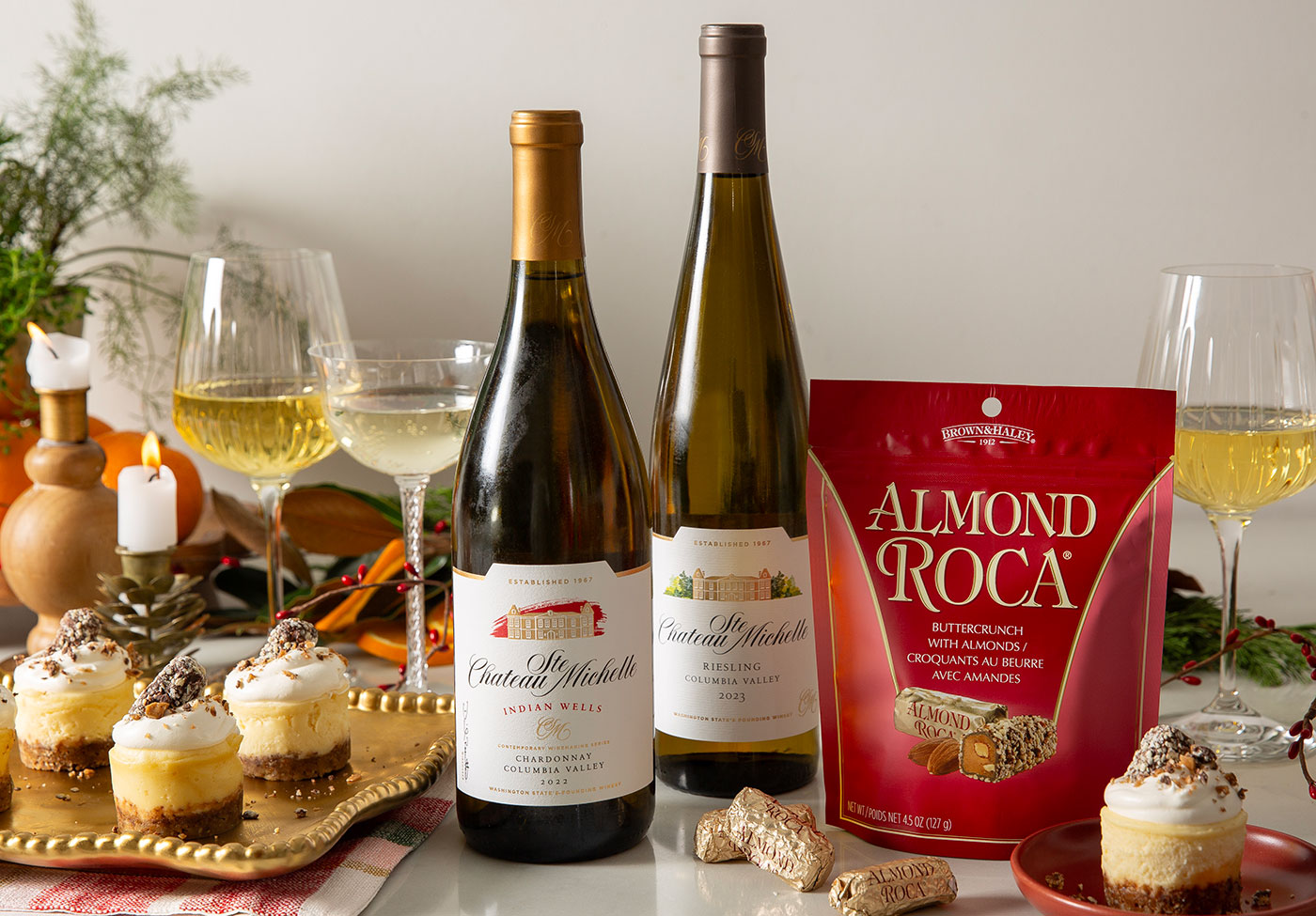 Bottles of Chateau Ste. Michelle wine with a package of Almond Roca