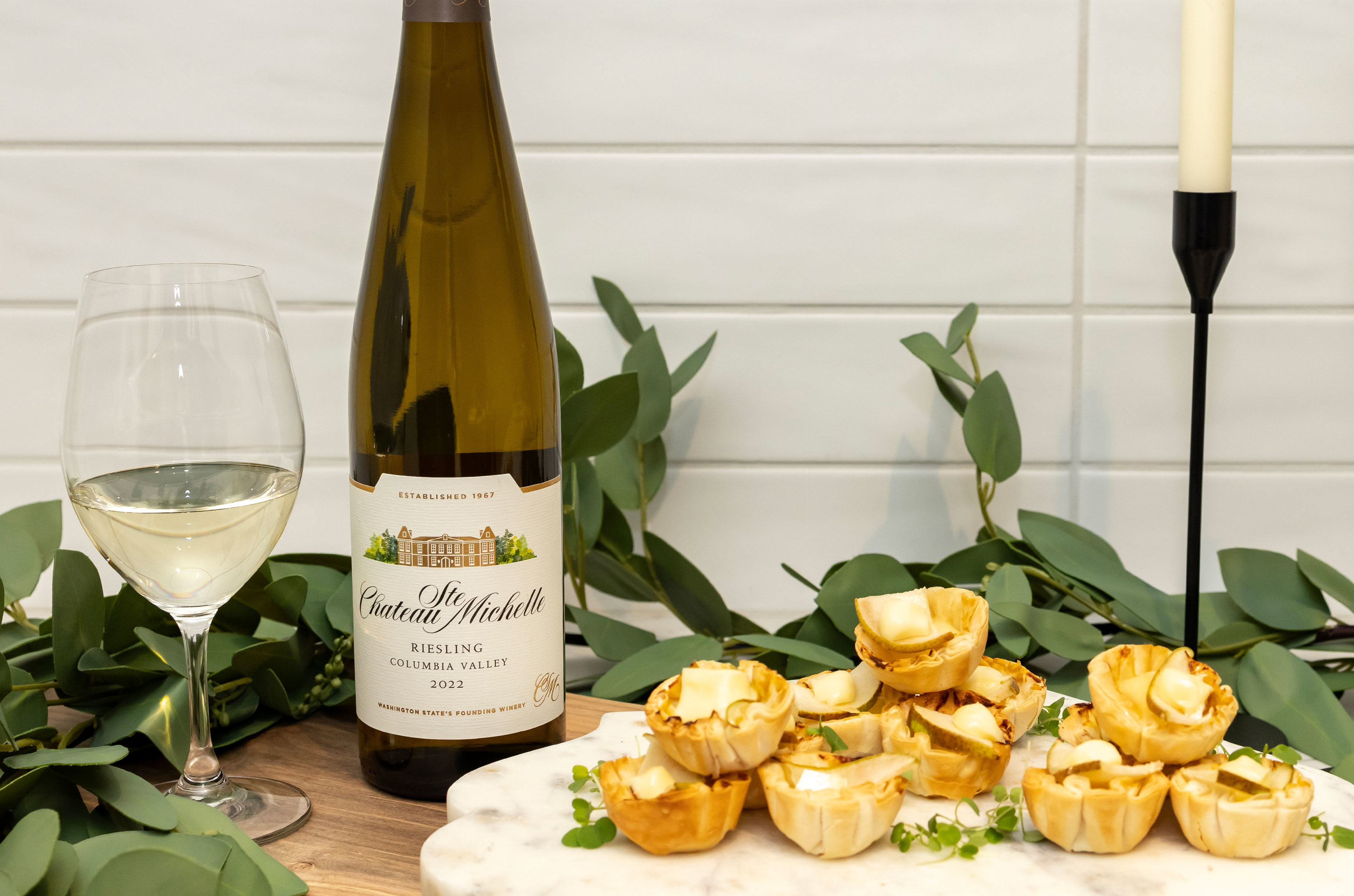 Pear and brie tarts with a bottle of Riesling