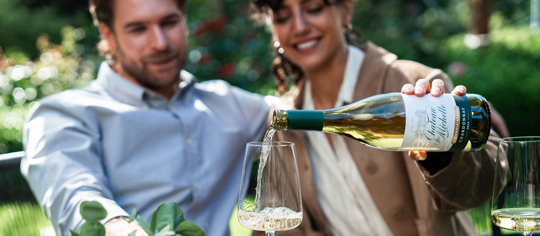 People enjoying white wine outside