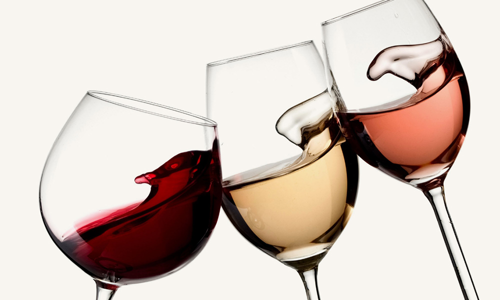 Glasses of wine swirling