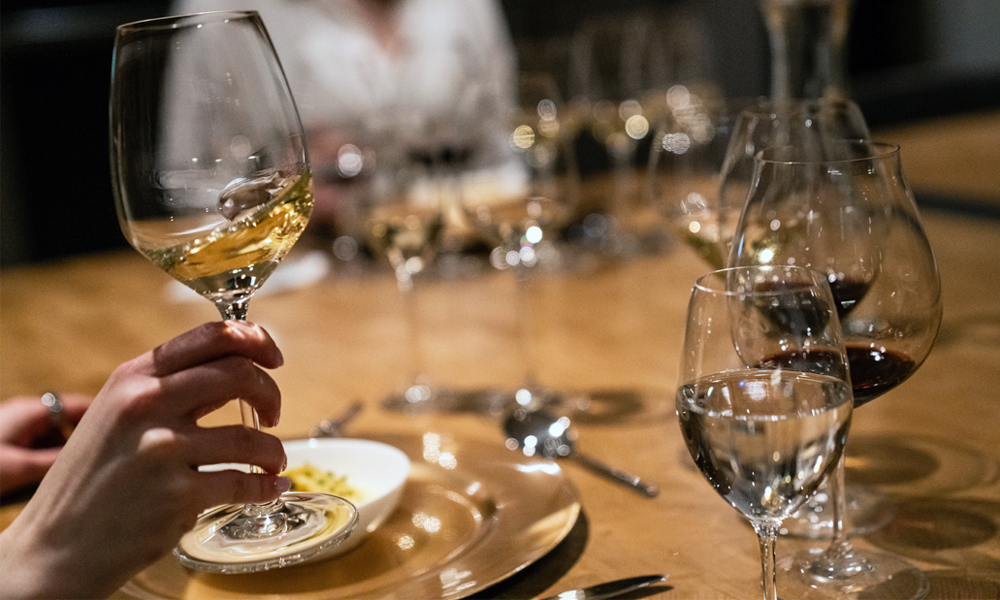 wine tasting glasses on a table with food