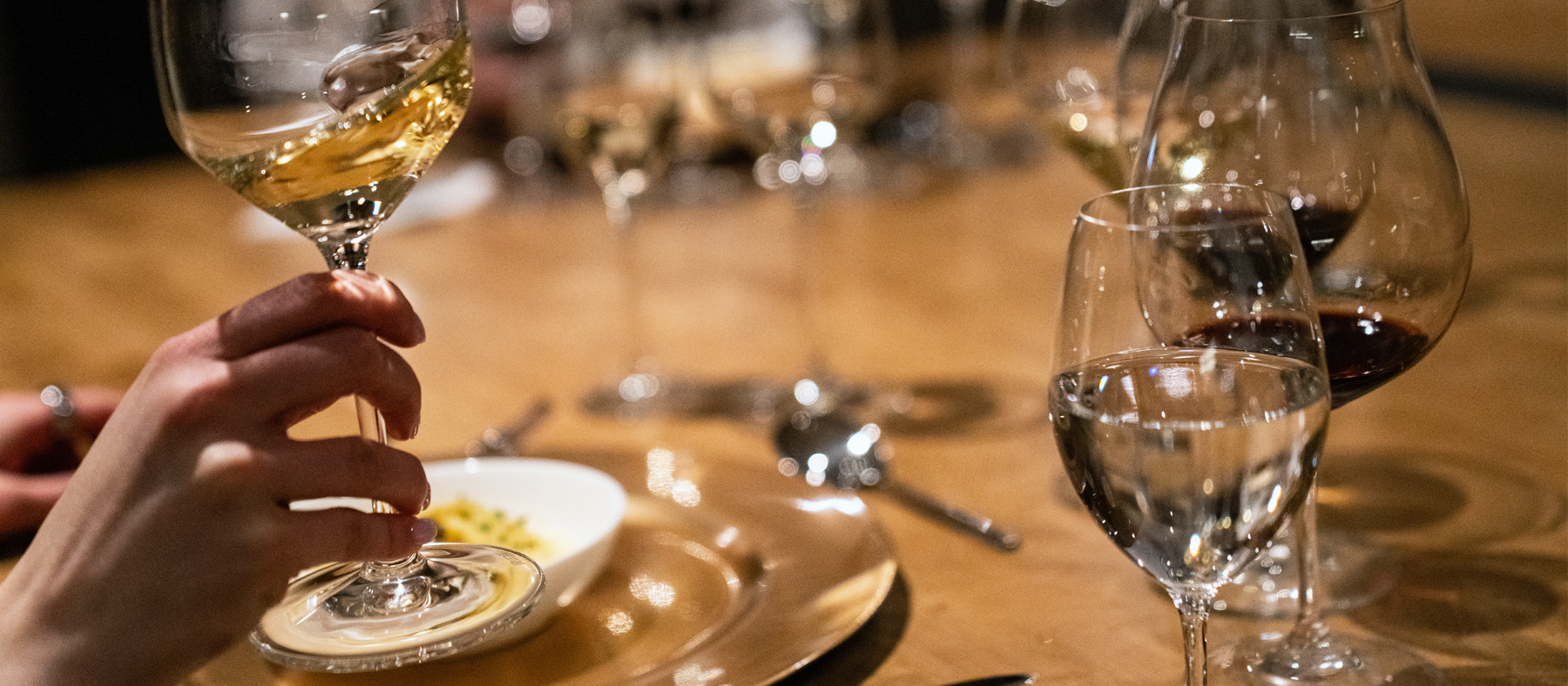 wine tasting glasses on a table with food