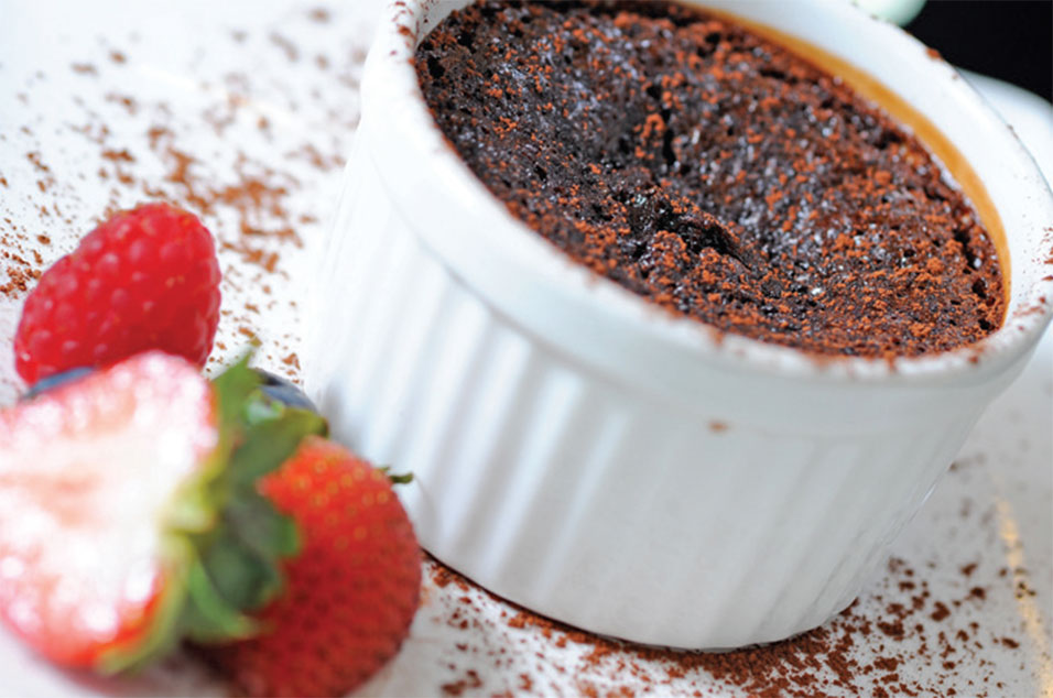 Lava Cake on a plate with strawberries