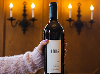 Hand holding a bottle of Ethos Reserve Cabernet Sauvignon