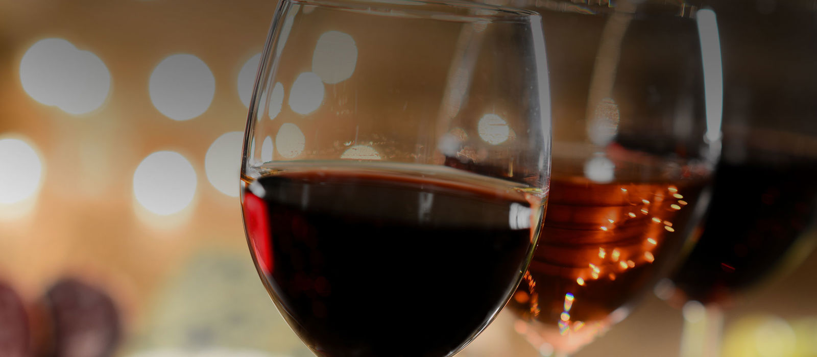 A close up of glasses of red and white wine
