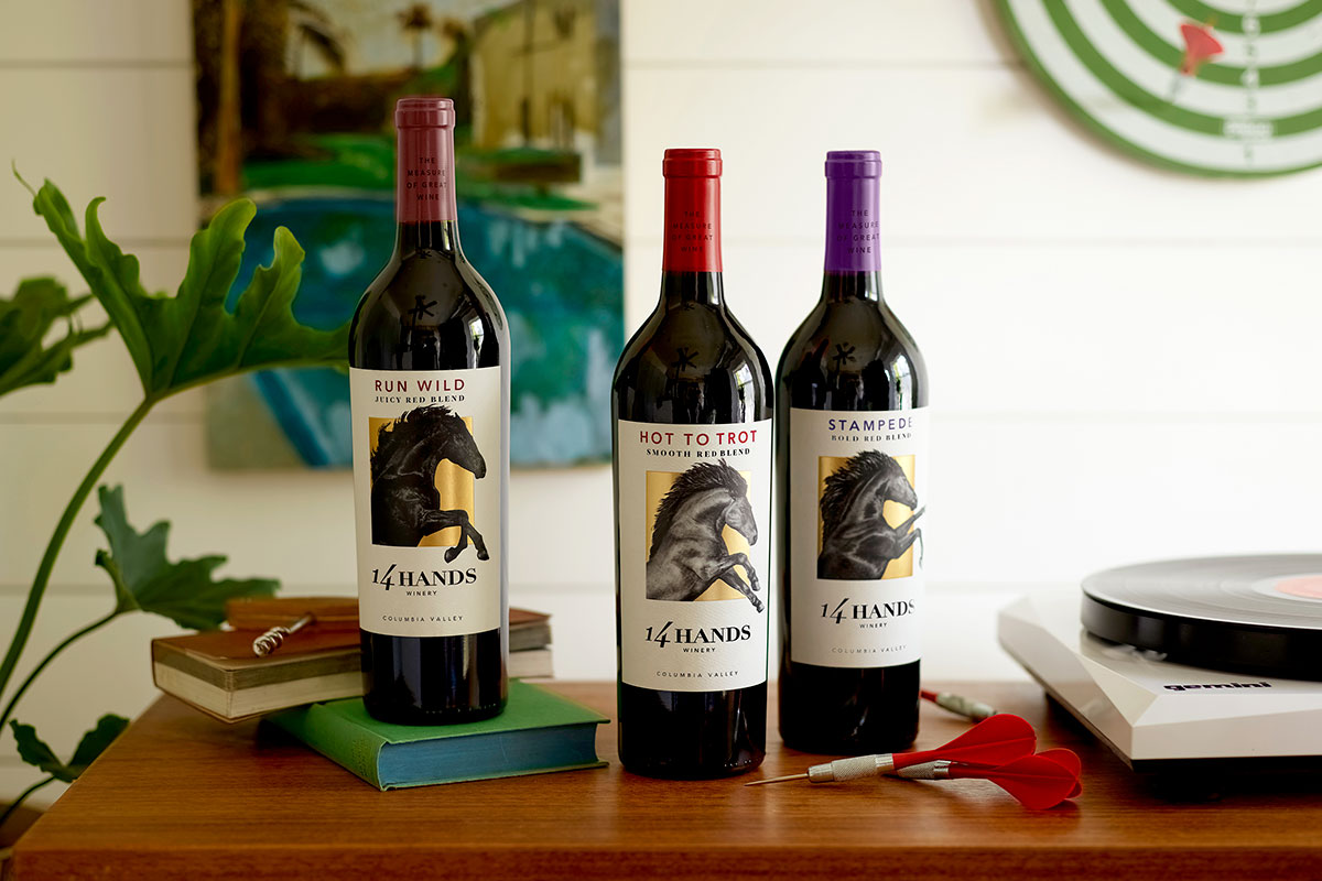 Bottles of 14 Hands blends next to a record player