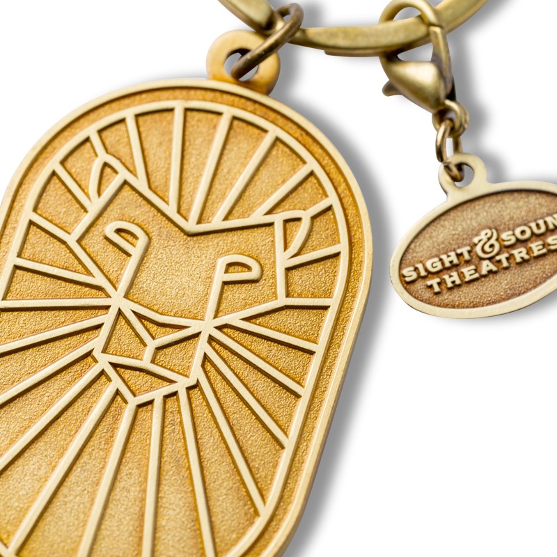 DANIEL KING IS COMING GOLD METAL KEYCHAIN WITH CHARM