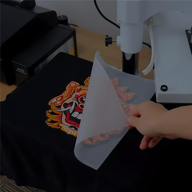 Background image of apparel decorating in action on a t-shirt.