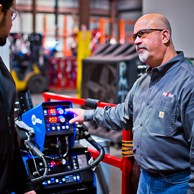 Weld automation specialist performing a demo of weld automation equipment