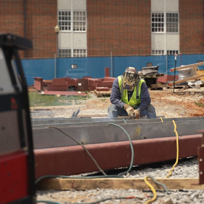 Welder welding steel on jobsite