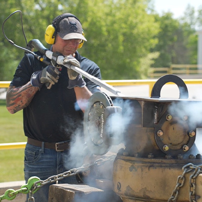 Man dry ice blasting equipment in the back of truck