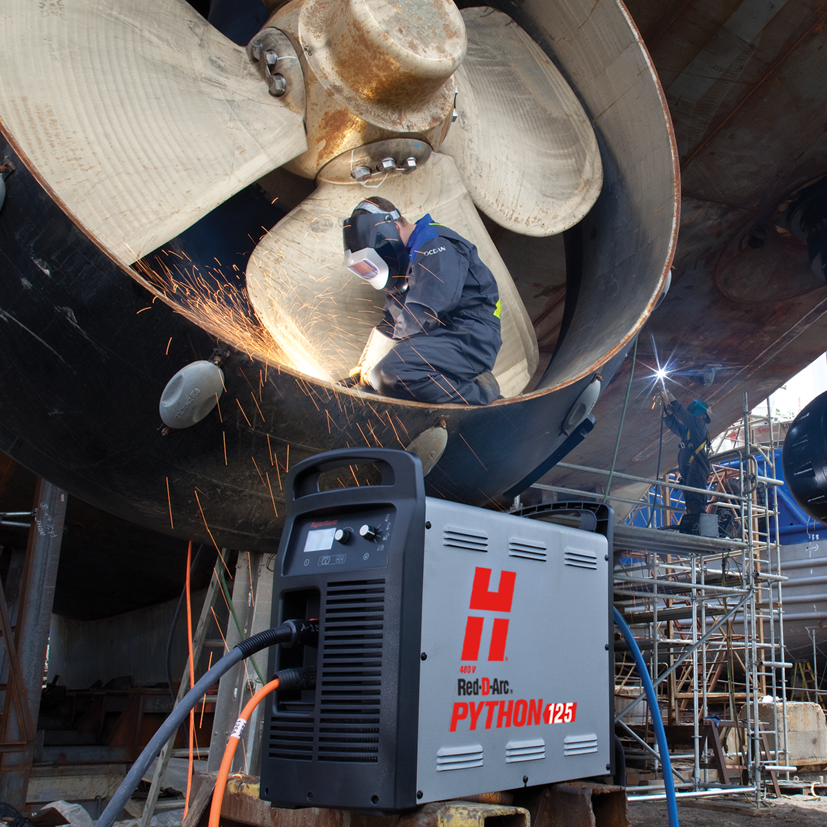 Welder using Hypertherm Python 125 to plasma cut in a ship propeller.