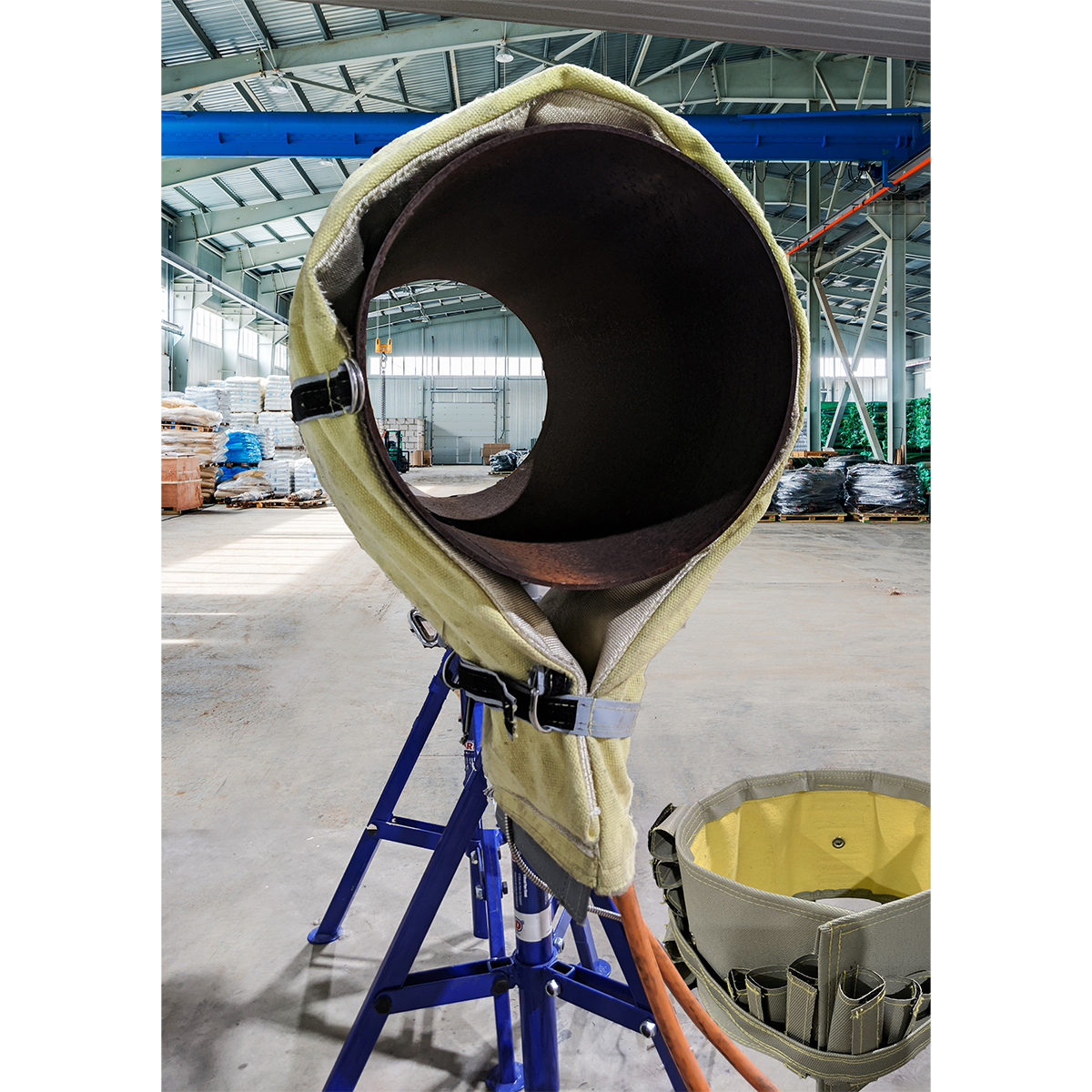 A Red-D-Wrap Induction Heating wrap being used on a pipe segment.
