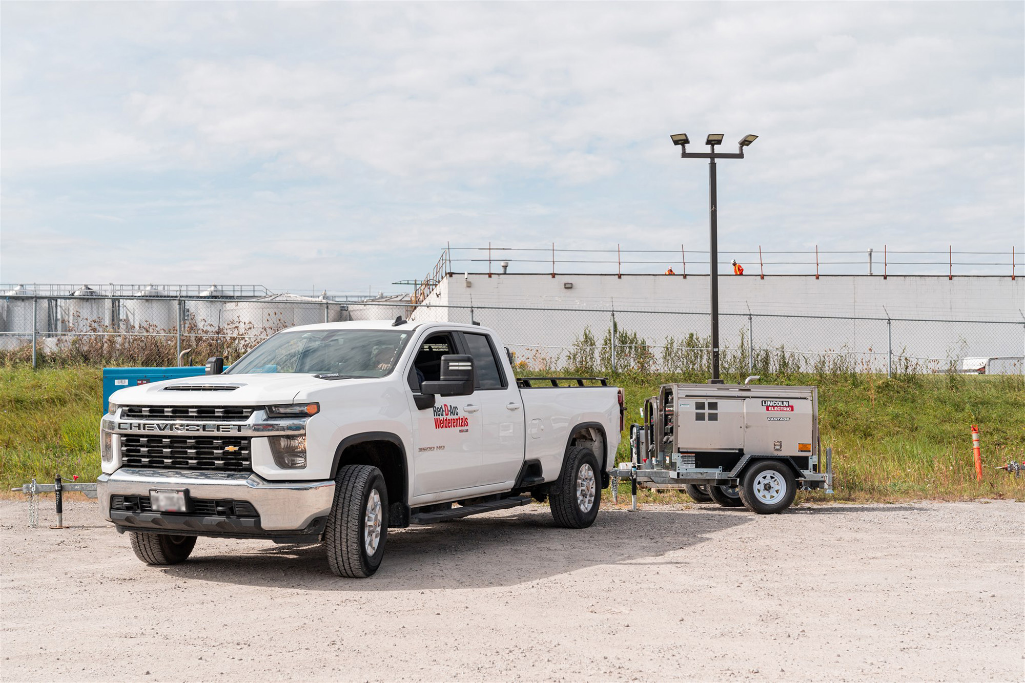 Company truck parked on a jobsite for a welding equipment delivery
