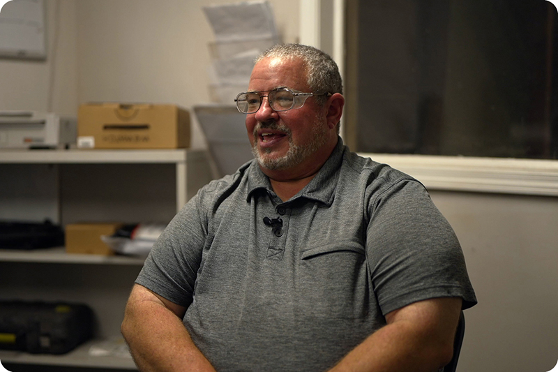 A happy customer being interviewed in office setting