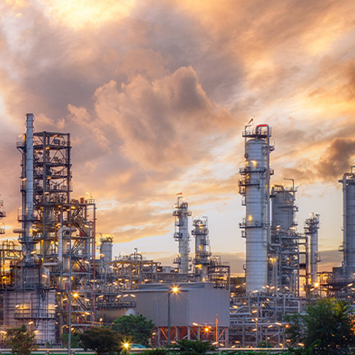 The refinery is an industrial area with sunrise and cloudy skies, oil and natural gas storage tanks, the refinery industry