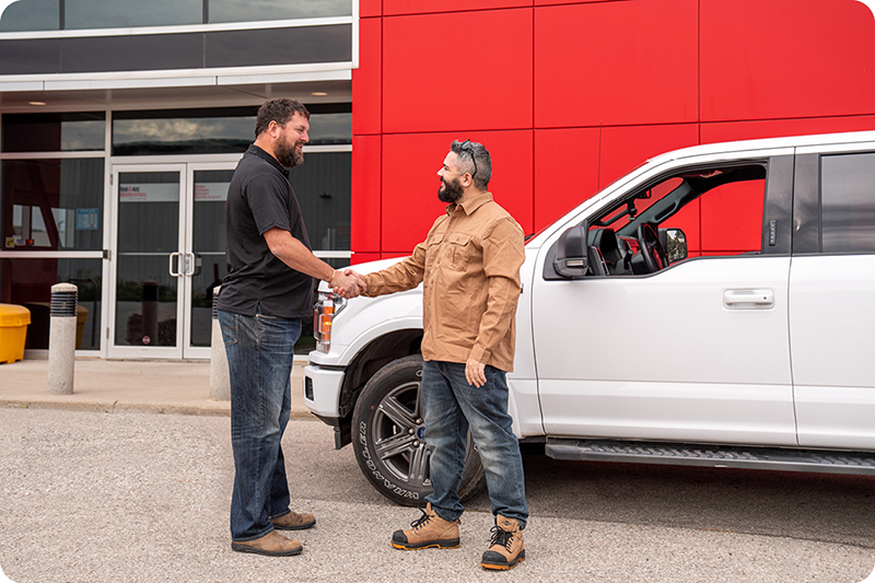 Customer and Red-D-Arc employee shaking hands and greeting each other in front of Ontario Rental Centre