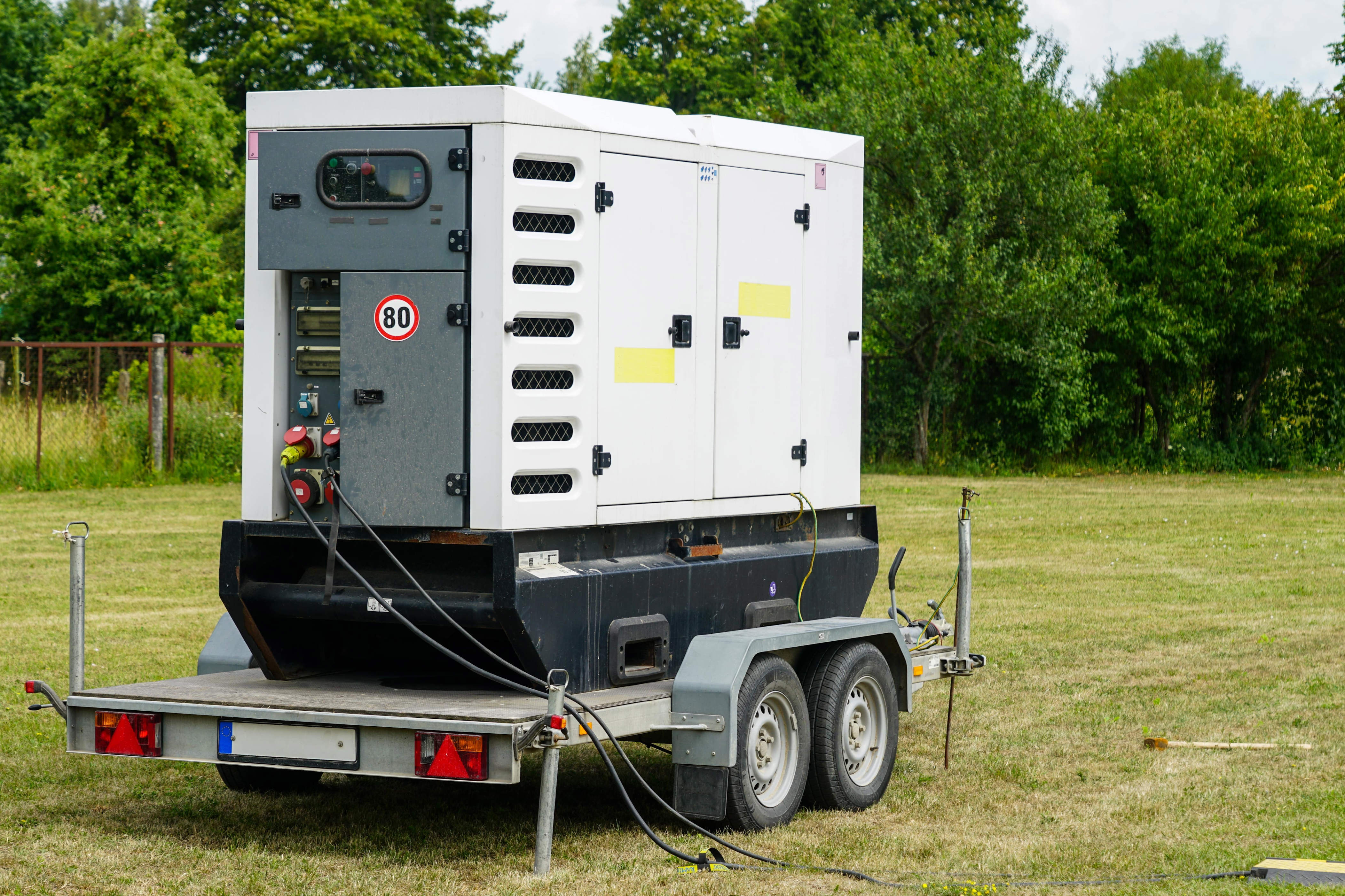 a diesel generator sitting on grass