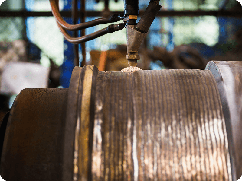 closeup of a submerged arc welding system in use