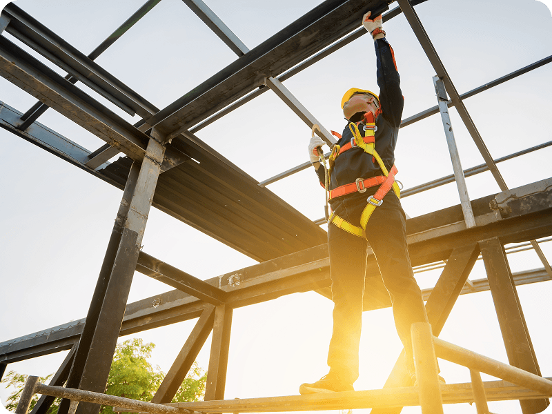 a man checking the structural integrity of welded beams