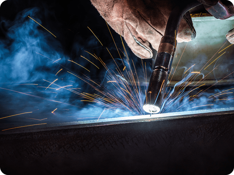 closeup of the operation of a flux-cored welder