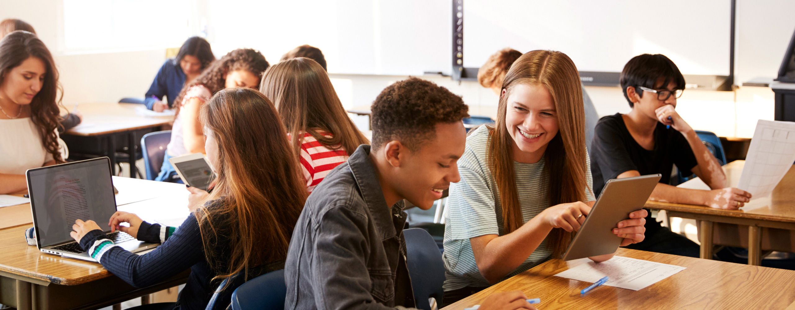 Students in a classroom using Christian Classroom Online