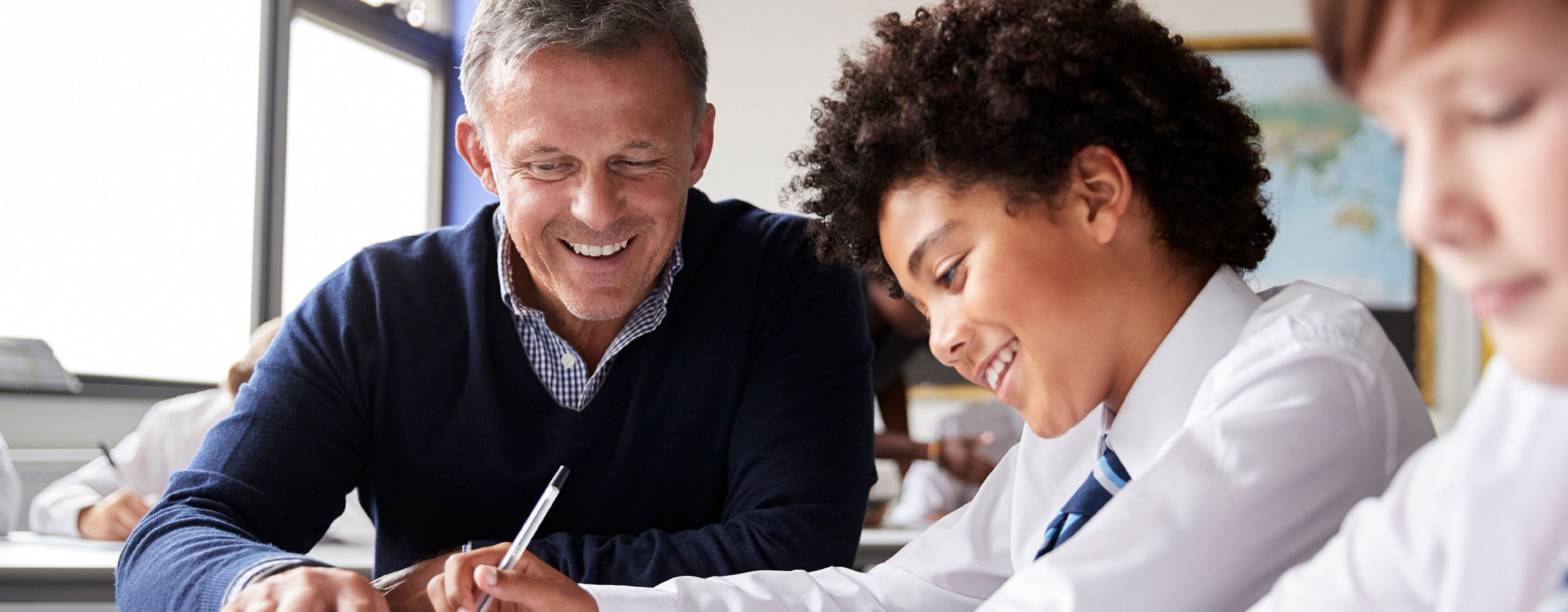 Teacher helping a student